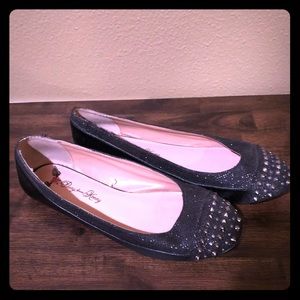 Black shimmer flats with stud toes
